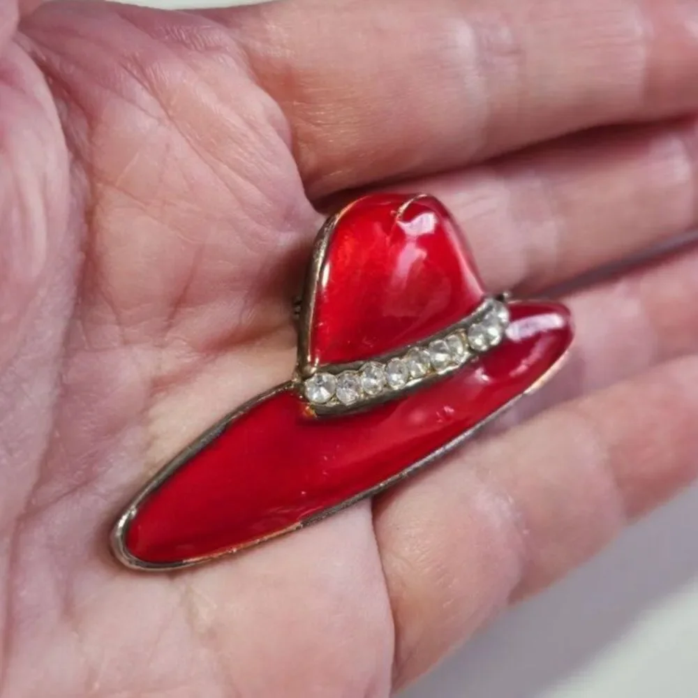 Gold tone red hat society brooch